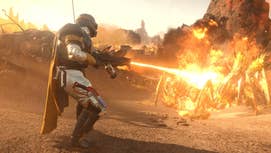 A Helldivers 2 player incinerating a Terminid with a flamethrower.